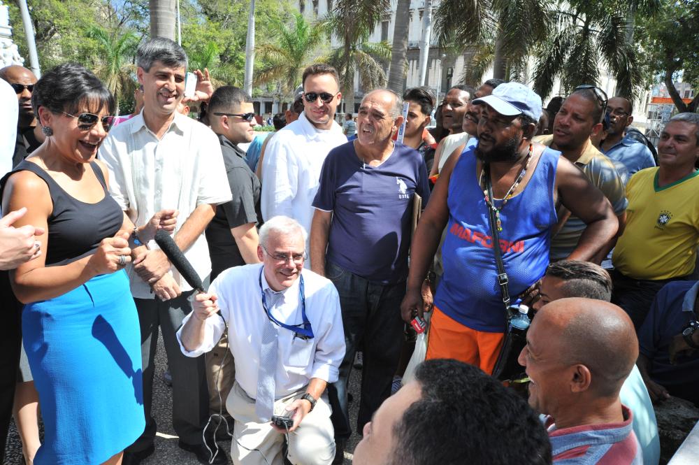Secretary Pritzker (left) speaks with Cuban citizens in the plaza