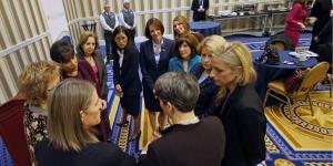 Secretary of Commerce Penny Pritzker huddles with 10 female U.S. Ambassadors at the 2015 SelectUSA Investment Summit. 
