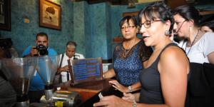 Secretary Pritzker (right) buys local coffee in Havana