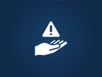 hand holding a caution sign