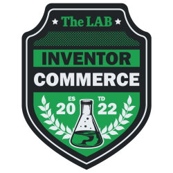 The LAB's inventor badge in black and green and white with a beaker representing the badge and wild olive leaves representing the department. 