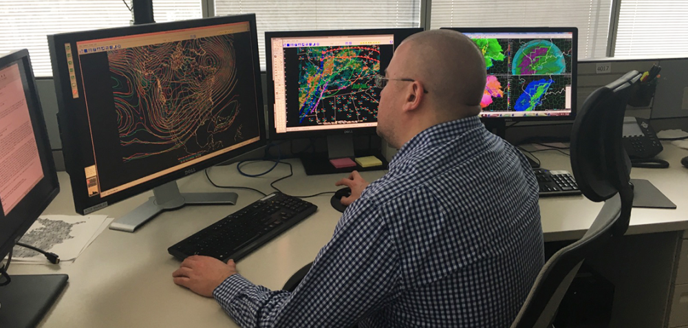 A National Weather Service meteorologist uses weather model data to generate precipitation forecasts.