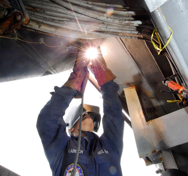A U.S. Navy welder works at the Puget Sound Naval Shipyard (U.S. Navy)