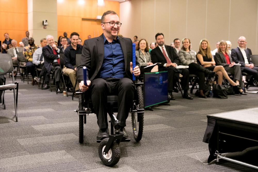 Co-founder of GRIT demonstrates the all-terrain Freedom Chair for persons with disabilities at World IP Day