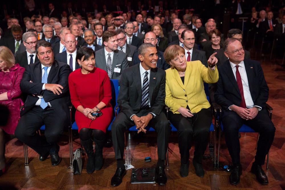 Secretary Pritzker, President Obama and Chancellor Merkel watching the Hannover Messe Opening Ceremony