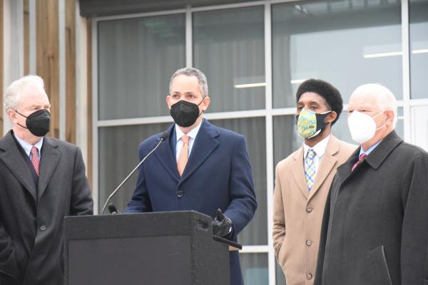 U.S. Deputy Secretary of Commerce Don Graves at podium with U.S. Senators Ben Cardin and Chris Van Hollen and Mayor Brandon Scott in Baltimore, Maryland.