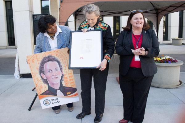 Joyce Ward, director of the USPTO’s Office of Education, and Molly Kocialski, director of the USPTO’s Rocky Mountain Regional Office, presented Temple Grandin with her USPTO inventor collectible card in Denver, Colorado on April 3, 2016. (Photo by Unsu Jung/USPTO)