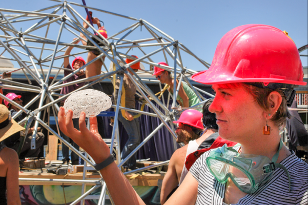 Bilenko examines a prototype of Dr. Brainlove, an interactive art car modeled on scans of her own brain. (Photo courtesy of Asako Miyakawa)