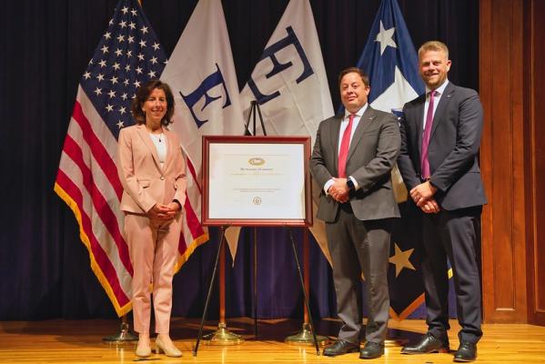 U.S. Secretary of Commerce Gina Raimondo presents First National Bank of Omaha, Omaha, Nebraska the “E” Award for Export Service for assisting and facilitating export activities.