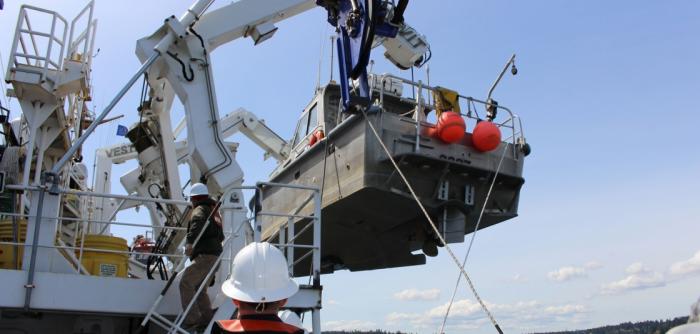 The crew of NOAA Ship Fairweather crew lower a launch into Puget Sound, Washington, for Hydrographic Systems Readiness Review testing. The crew of NOAA Ship Fairweather crew lower a launch into Puget Sound, Washington, for Hydrographic Systems Readiness Review testing.