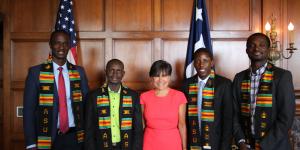 Secretary Penny Pritzker poses with four Mandela Washington Fellows