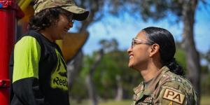 DOD Military Photo, Air Force Airman 1st Class and her son share a laugh at Vandenberg Space Force Base, Calif.