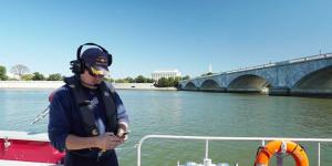 Alexandria (Va.) Fire Captain Phil Perry uses a mobile device while on board a fire boat on the Potomac River