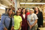 Commerce Secretary Gina Raimondo with employees at the Nontraditional Employment for Women (NEW) in New York City.