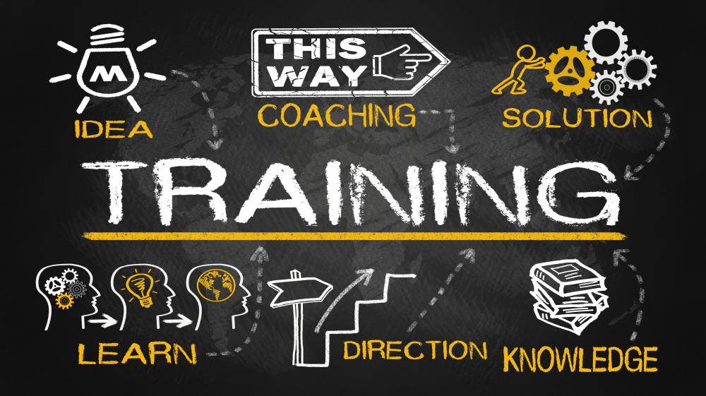 An image of blackboard with the word Training in the middle surrounded by another icon: idea, coaching, solution, learn, direction, knowledge